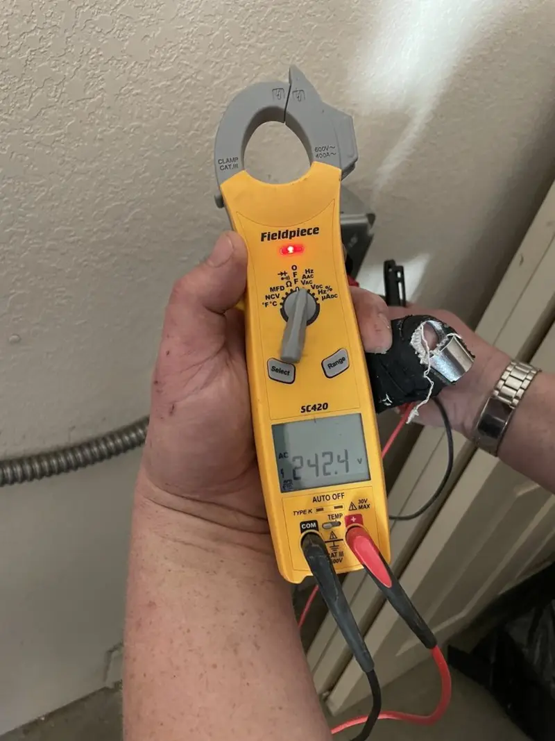 Voltage testing with clamp meter during Electrical Installation Services in Crystal Lake